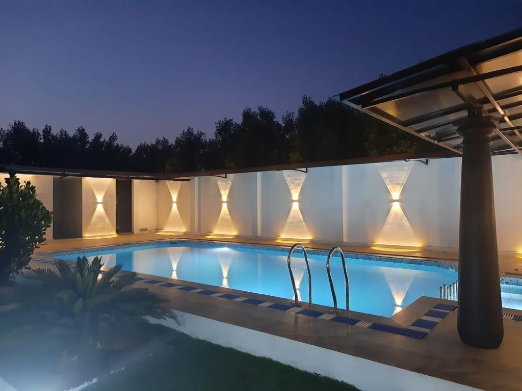 Refreshing swimming pool at Nellai Farm House for guests